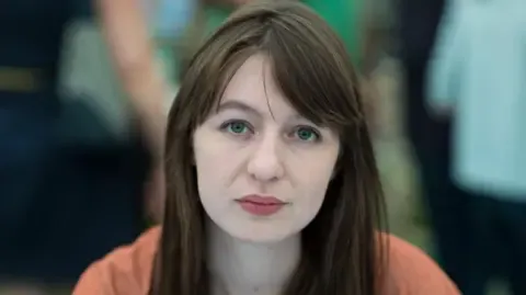 The acclaimed novelist declares she is unable to travel to the UK due to legal concerns